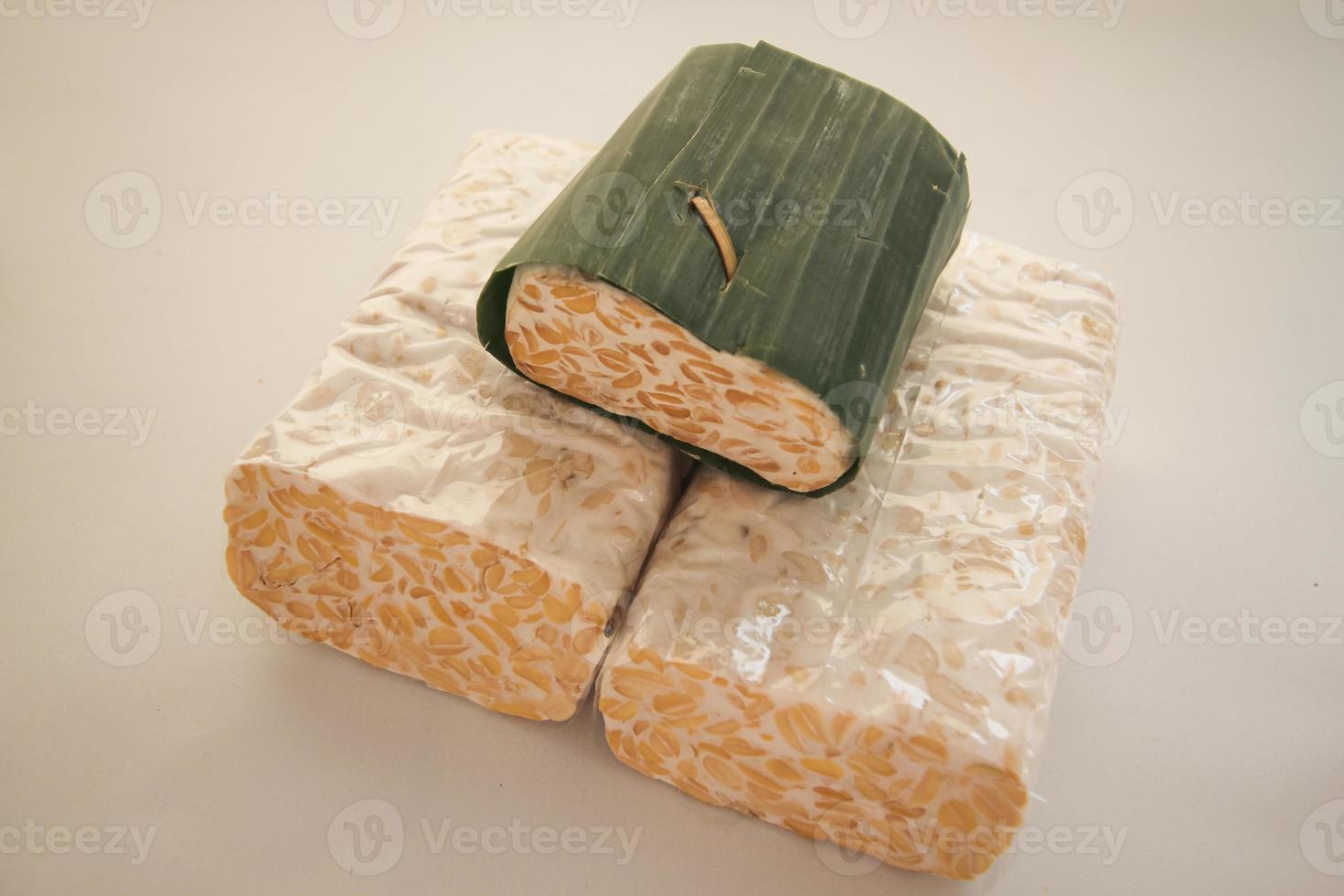 Tempeh Or Tempe is Indonesian traditional food made from fermented soybeans. They are usually wrapped in banana leaves photo