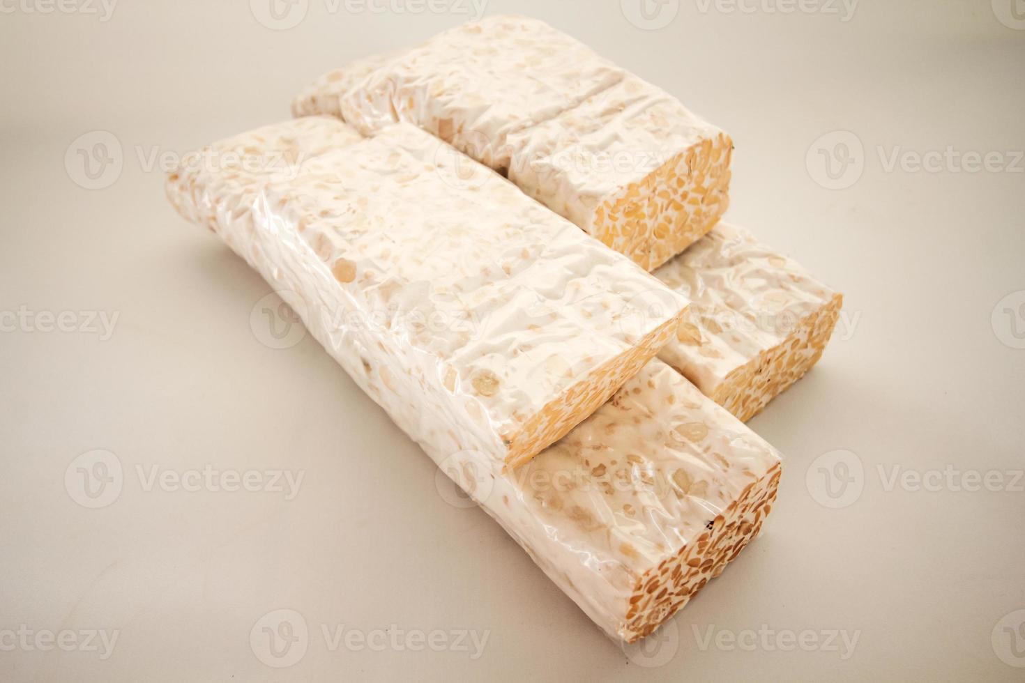 Tempeh or Tempe is Indonesian traditional food made from fermented soybeans. They are usually wrapped in banana leaves photo