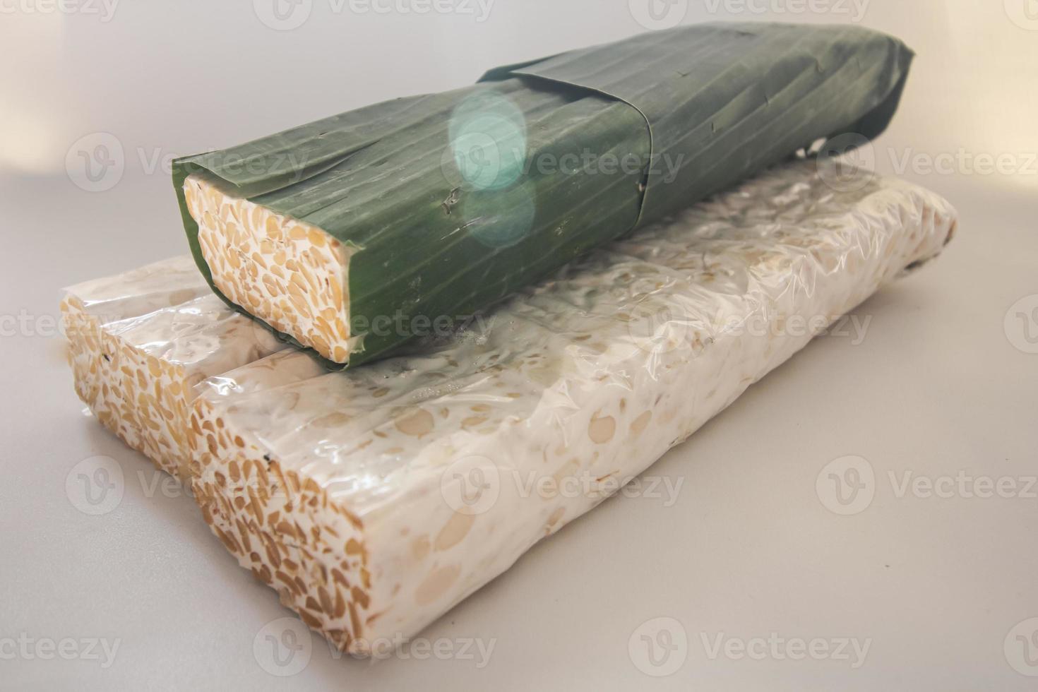 Tempeh Or Tempe is Indonesian traditional food made from fermented soybeans. They are usually wrapped in banana leaves photo