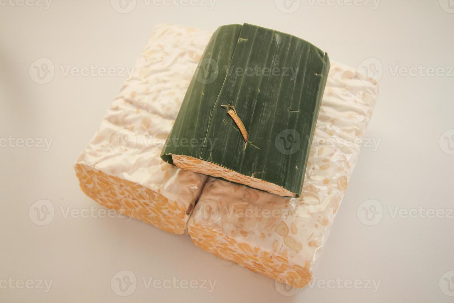 Tempeh or Tempe is Indonesian traditional food made from fermented soybeans. They are usually wrapped in banana leaves photo