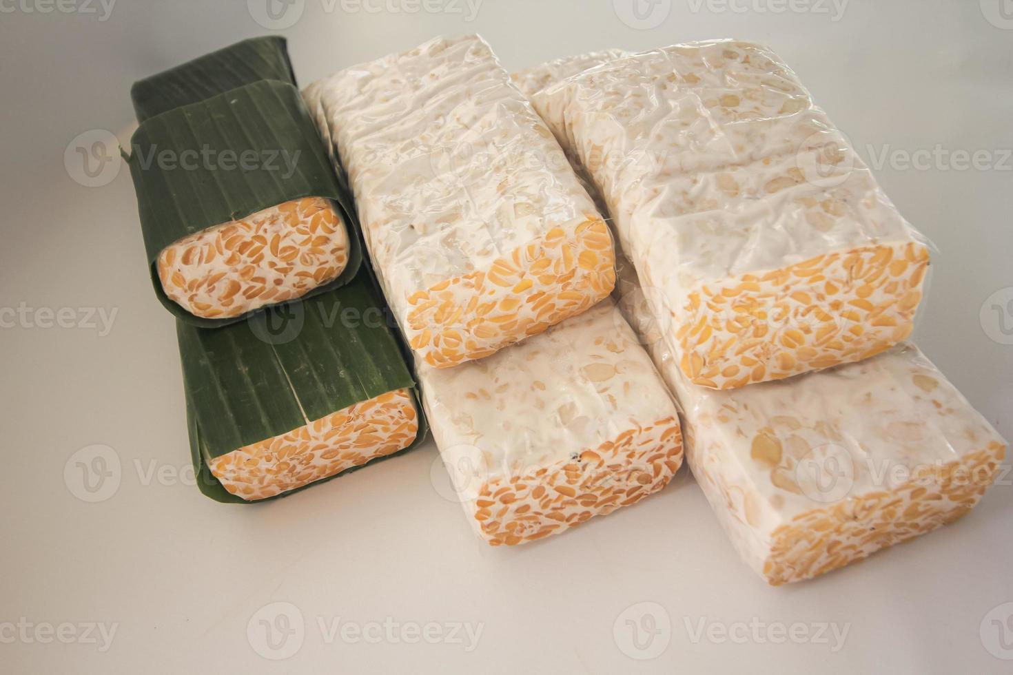Tempeh Or Tempe is Indonesian traditional food made from fermented soybeans. They are usually wrapped in banana leaves photo