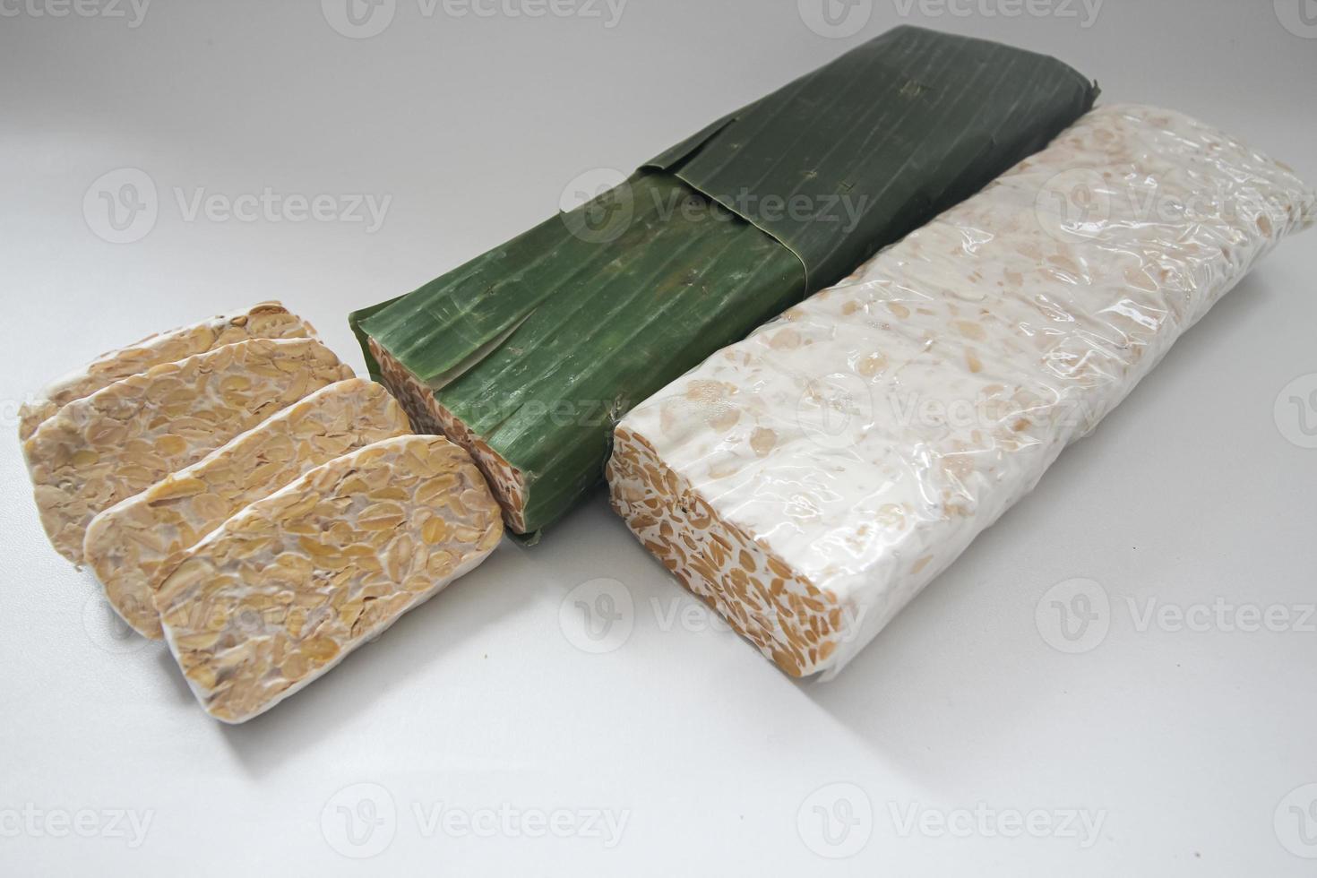 Tempeh Or Tempe is Indonesian traditional food made from fermented soybeans. They are usually wrapped in banana leaves photo