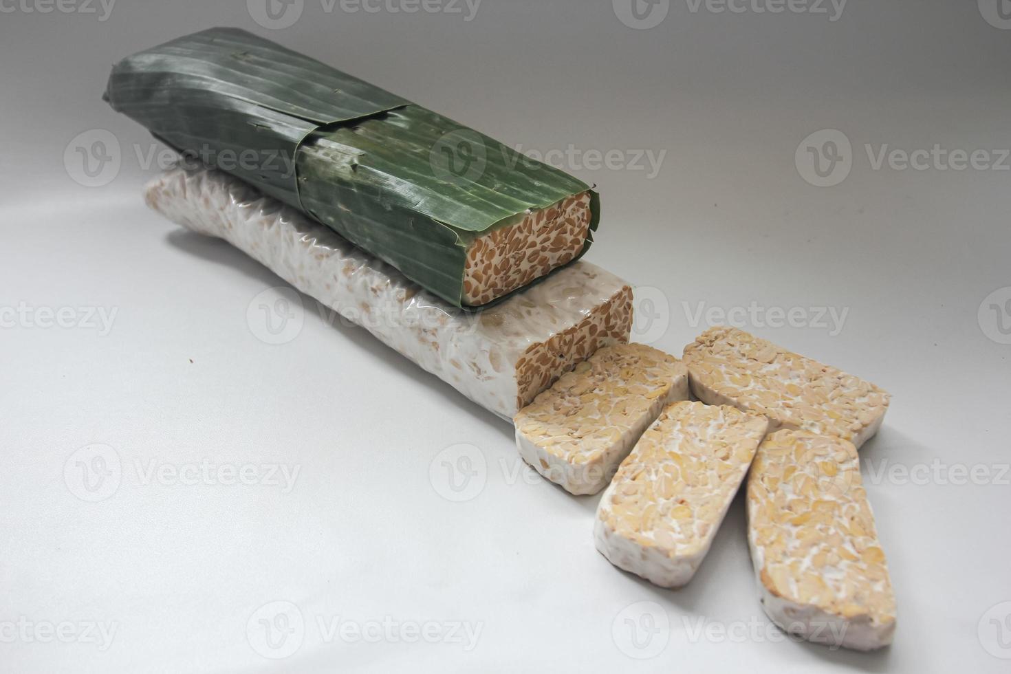 Tempeh Or Tempe is Indonesian traditional food made from fermented soybeans. They are usually wrapped in banana leaves photo