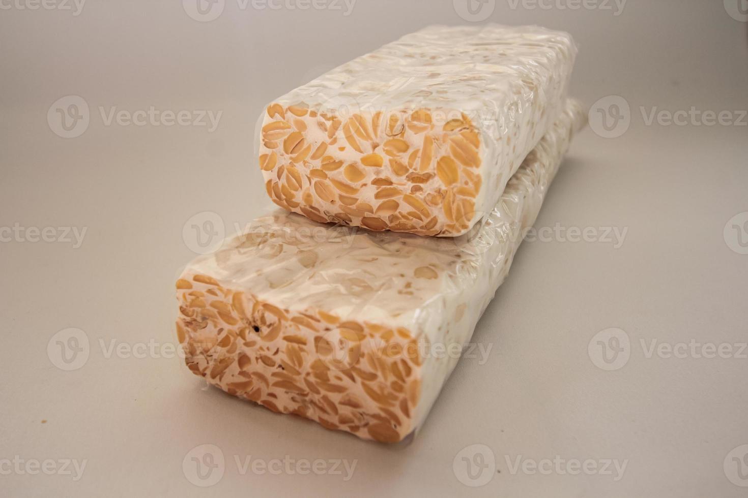 Tempeh Or Tempe is Indonesian traditional food made from fermented soybeans. They are usually wrapped in banana leaves photo