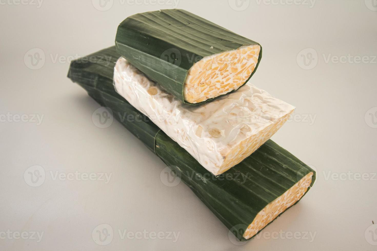 Tempeh or Tempe is Indonesian traditional food made from fermented soybeans. They are usually wrapped in banana leaves photo