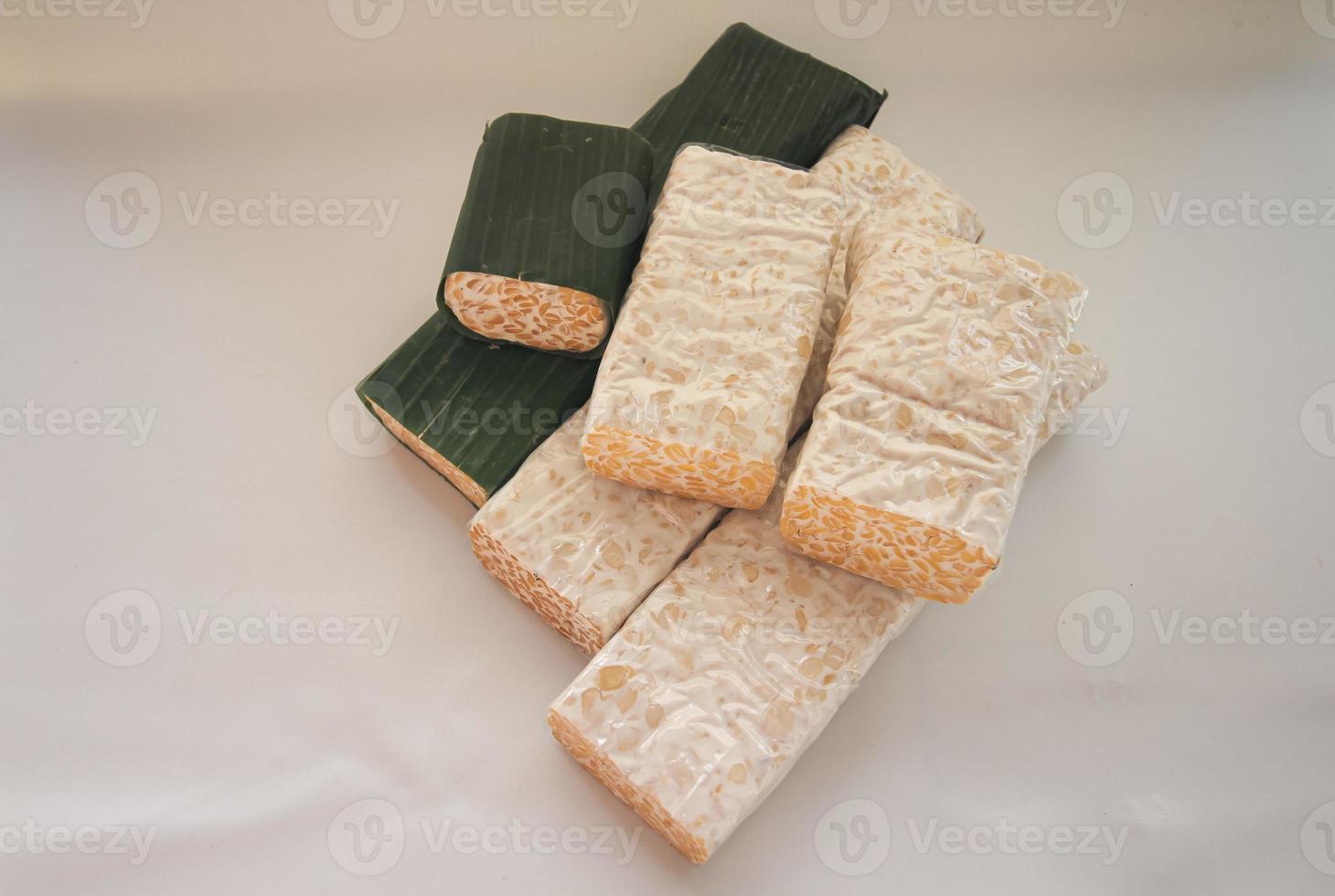 Tempeh Or Tempe is Indonesian traditional food made from fermented soybeans. They are usually wrapped in banana leaves photo