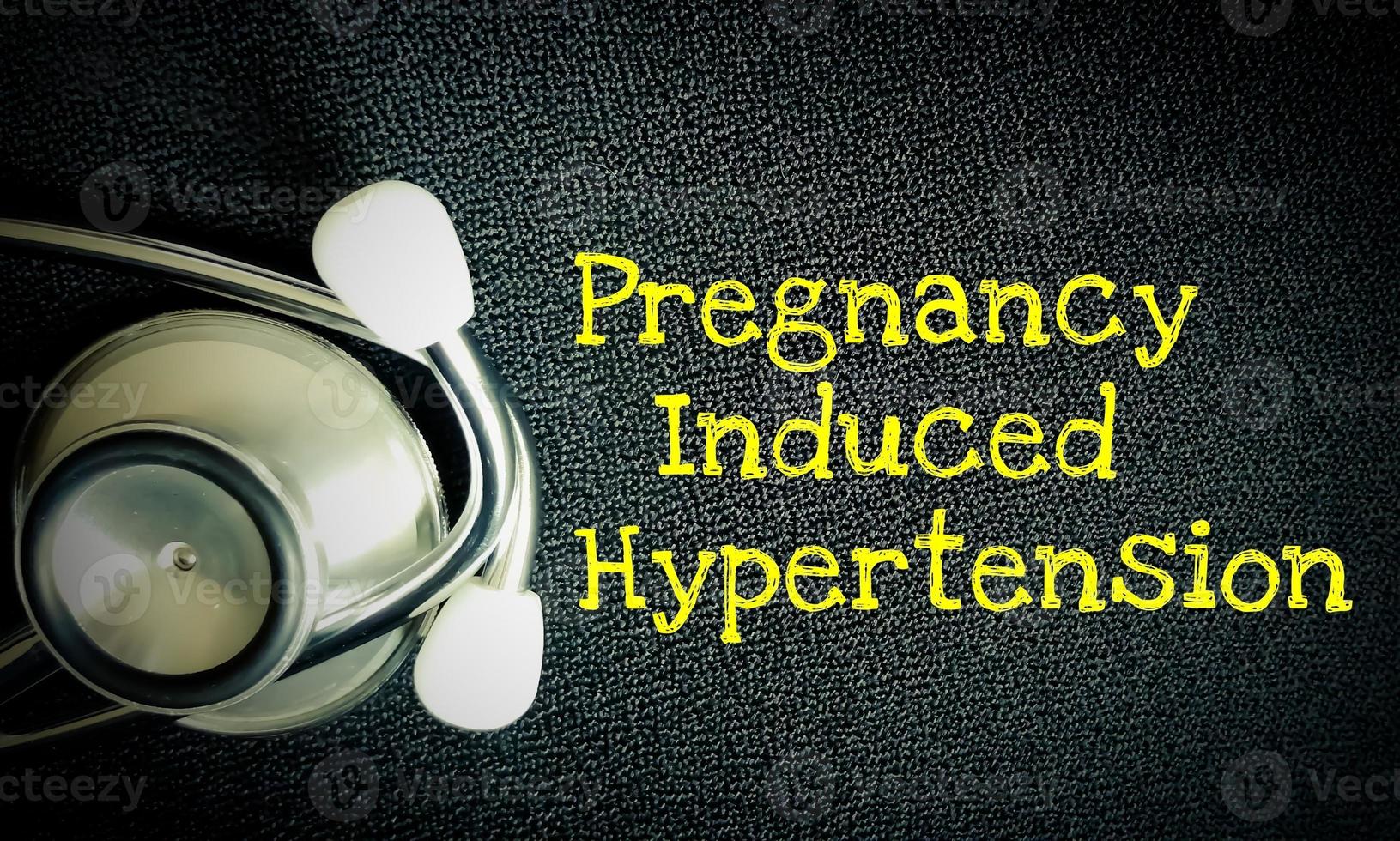 Pregnancy Induced Hypertension medical term with black background. medical conceptual image. photo