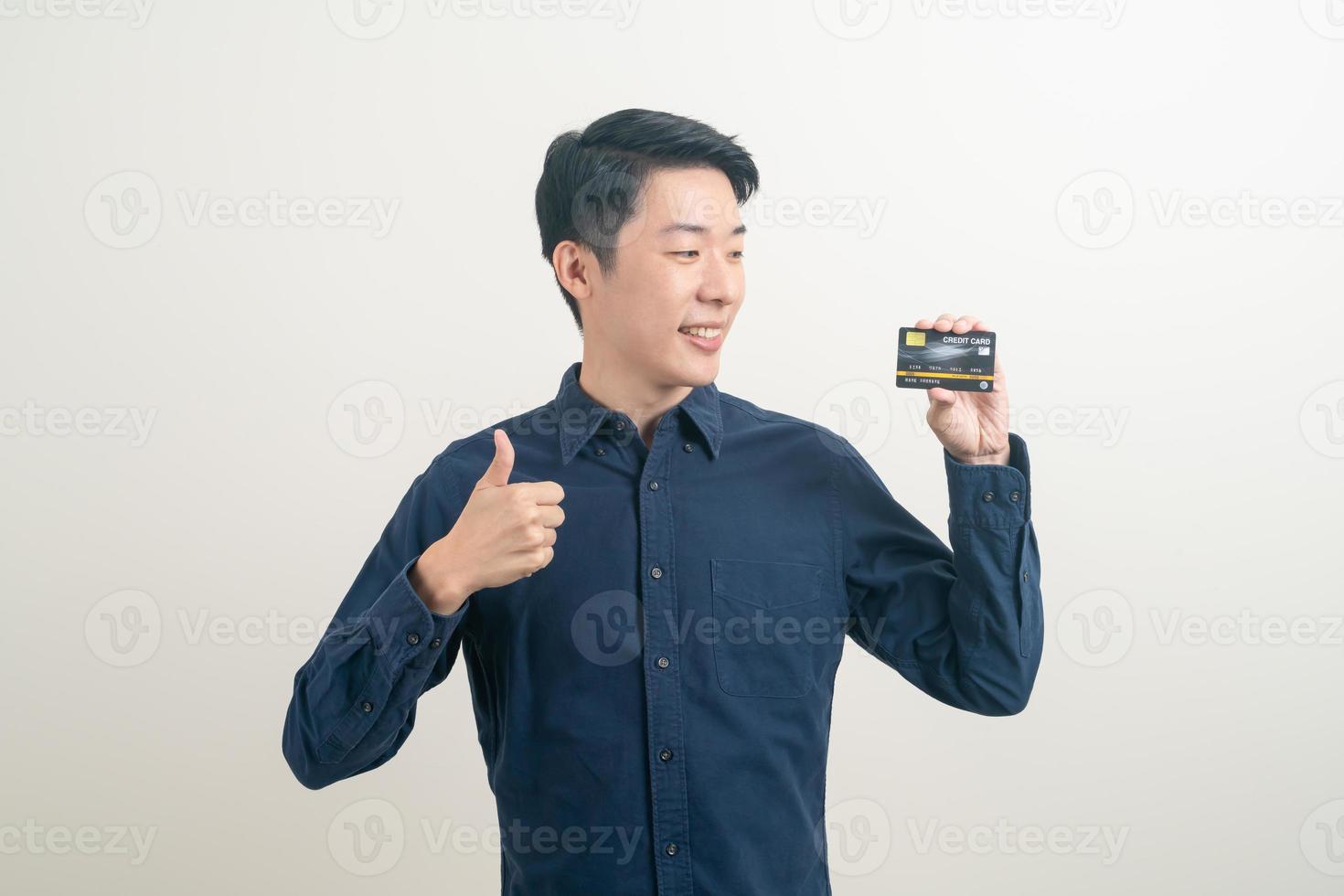 young Asian man holding credit card photo