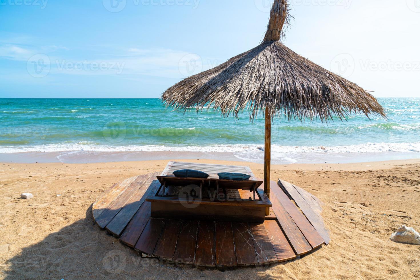 beach chair and umbrella with sea beach background photo