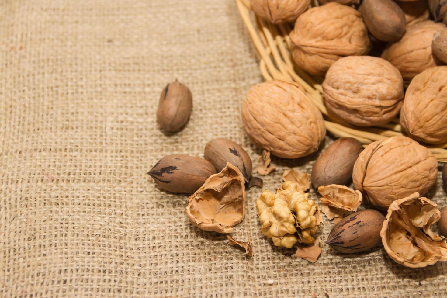 variety of healthy nuts on rustic background photo