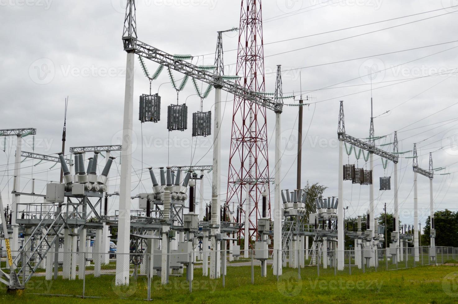 Metal transmission line with the components of the electric network, the system of power equipment for the transmission of electricity, electric current with the transformer at the power station photo