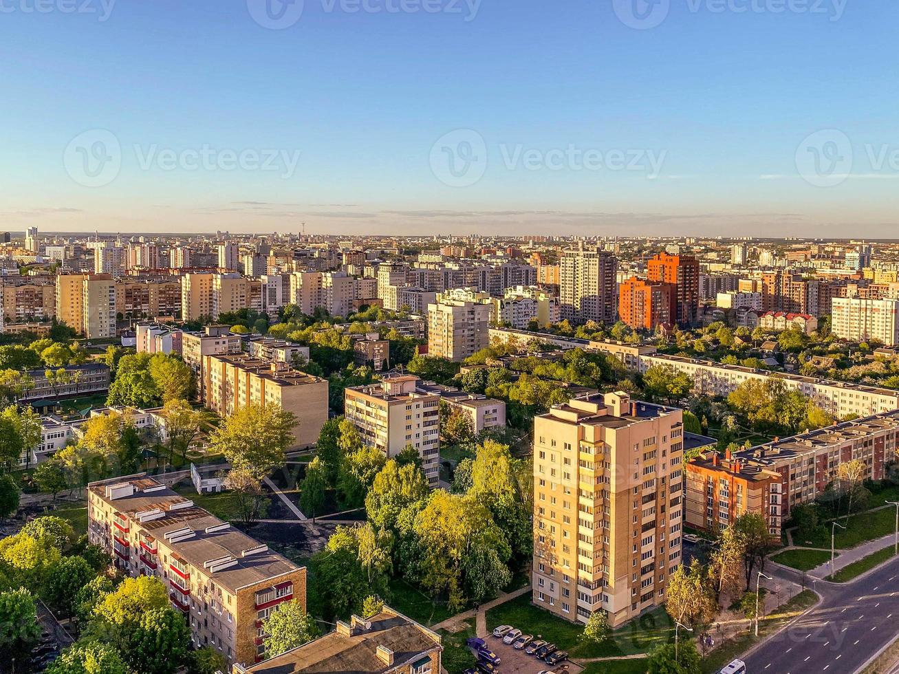panorama of the city from above. high residential buildings made of concrete for people's lives. near a green park, a lot of trees. city view photo