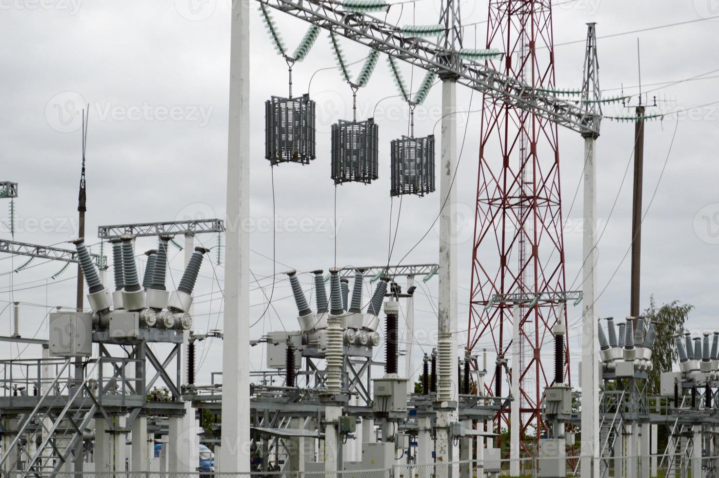 Metal transmission line with the components of the electric network, the system of power equipment for the transmission of electricity, electric current with the transformer at the power station photo