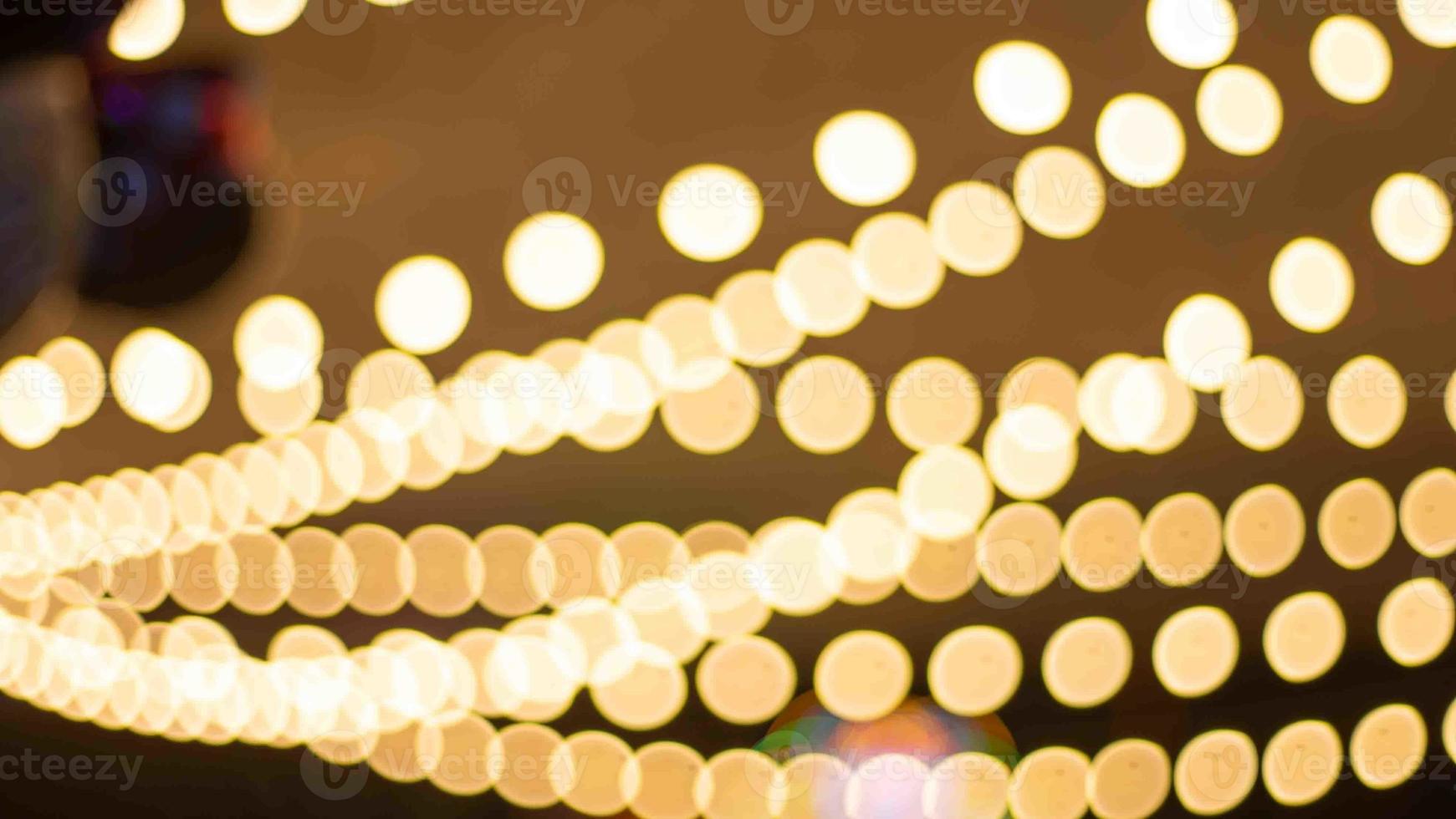 The whole bokeh image shows the yellow light in a flash. as wallpaper Focus on blurring the entire image to create bokeh of light photo