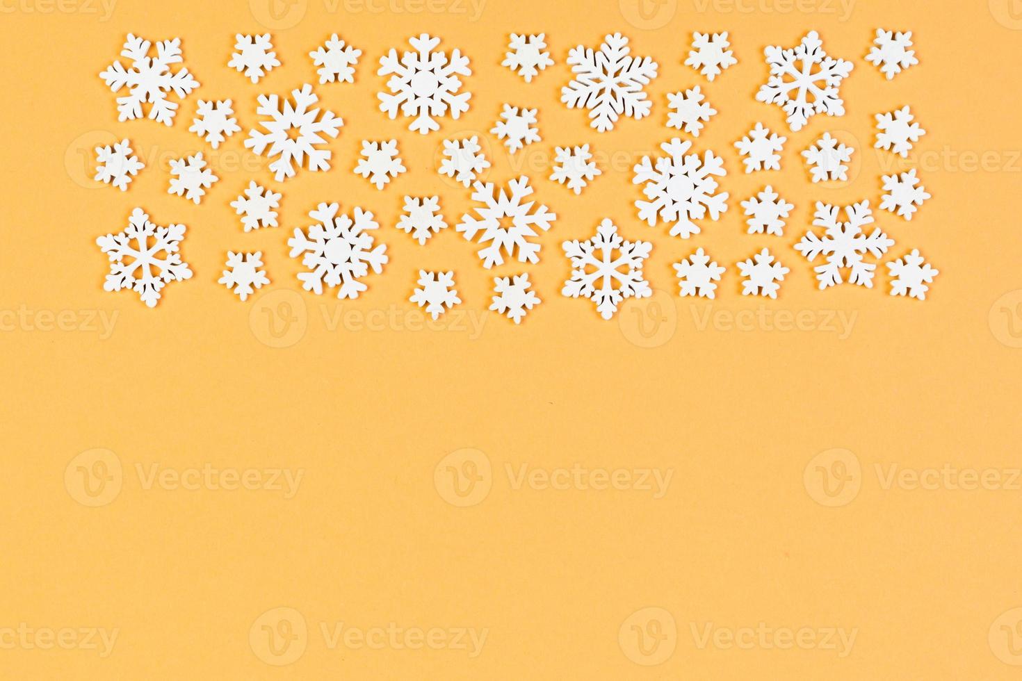 Set of white snowflakes on colorful background. Top view of Christmas ornament. New Year time concept with empty space for your design photo