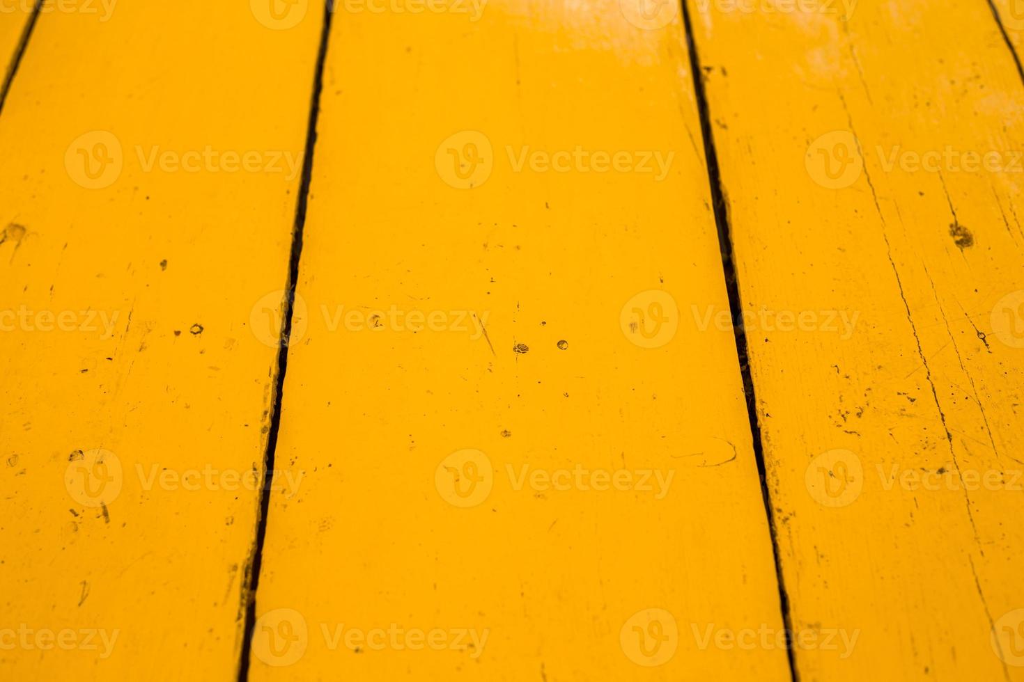 A wooden garden table in a detail. Yellow wooden table 14262362 Stock