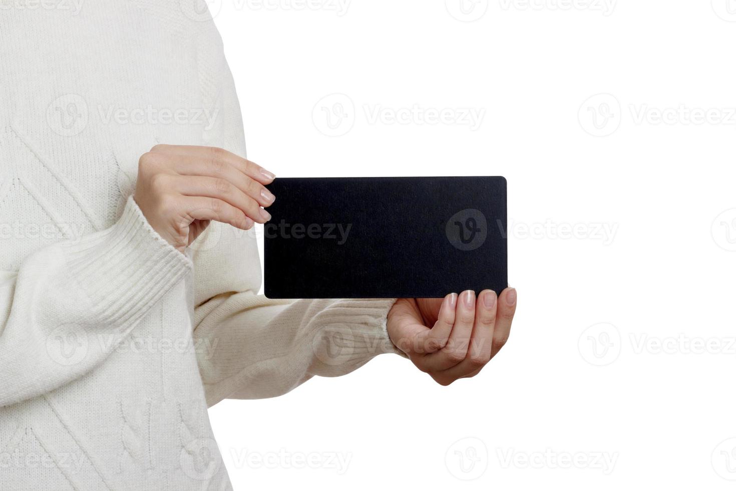 Girl holding an small blackboard isolated on white background photo