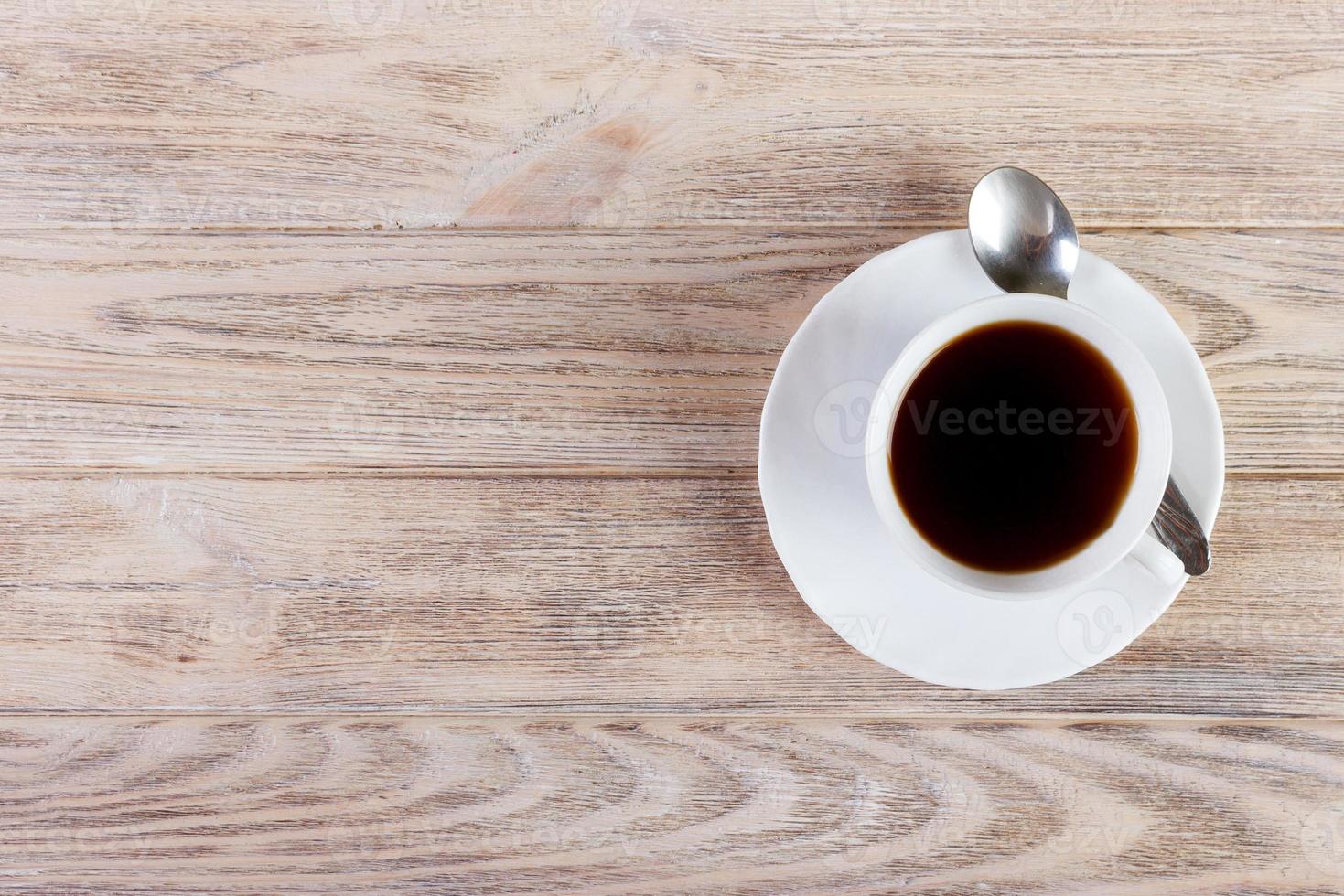Top view of coffee cup on a wood background with copy space photo