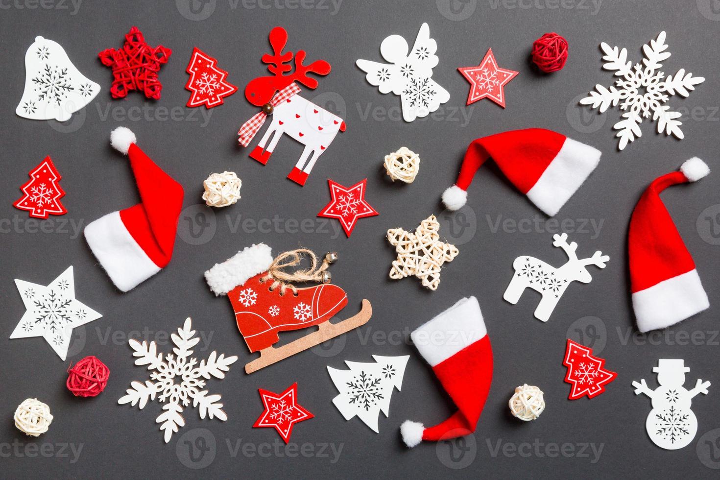 Top view of New Year decorations on black background. Merry Christmas concept photo