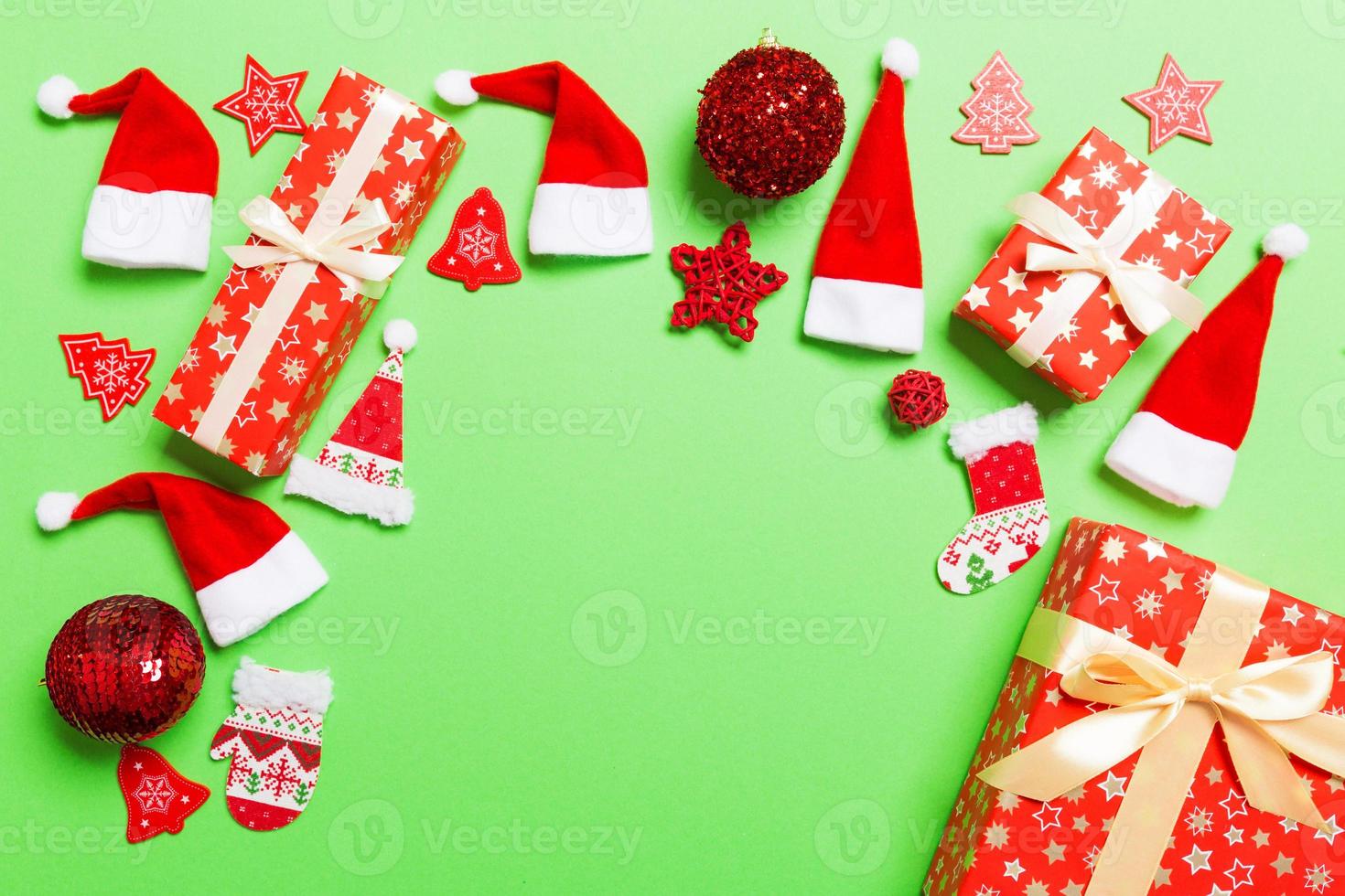 Top view of Christmas decorations on green background. New Year holiday concept with copy space photo