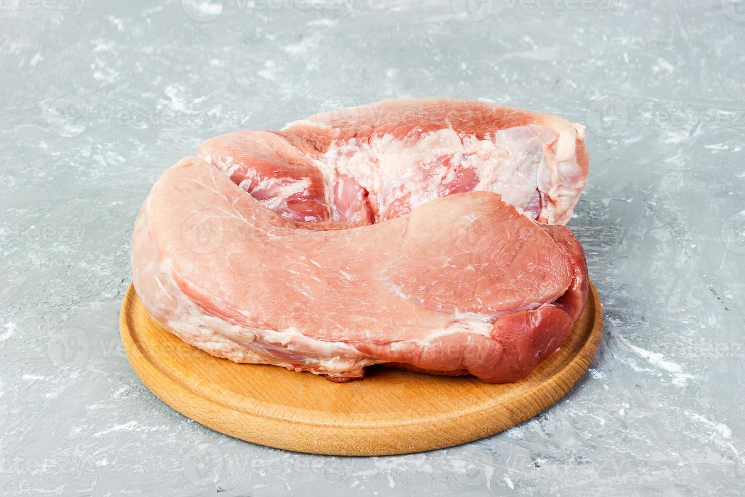 Raw pork meat on a gray background . Top view photo