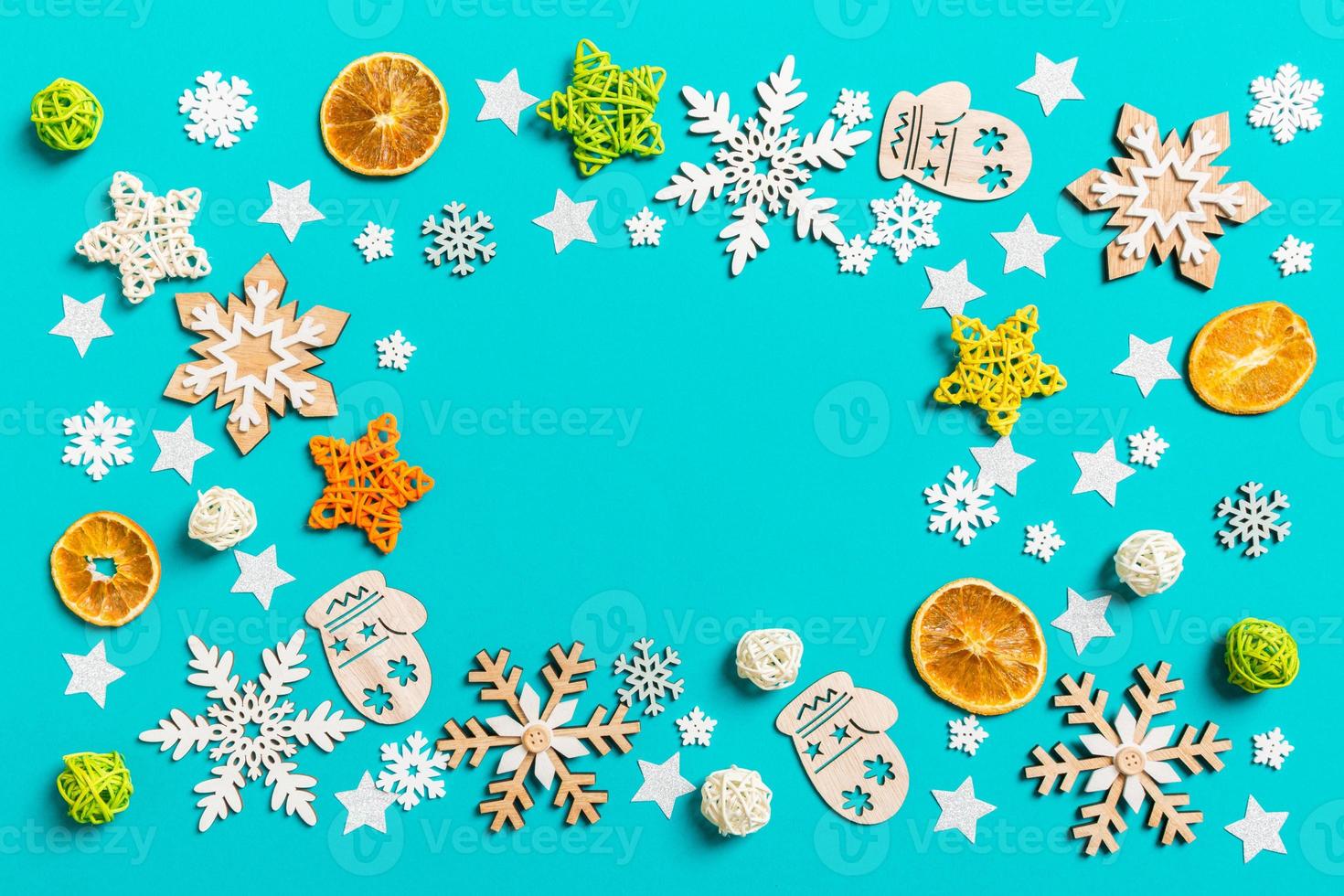 Top view of blue background with New Year toys and decorations. Christmas time concept with copy space photo