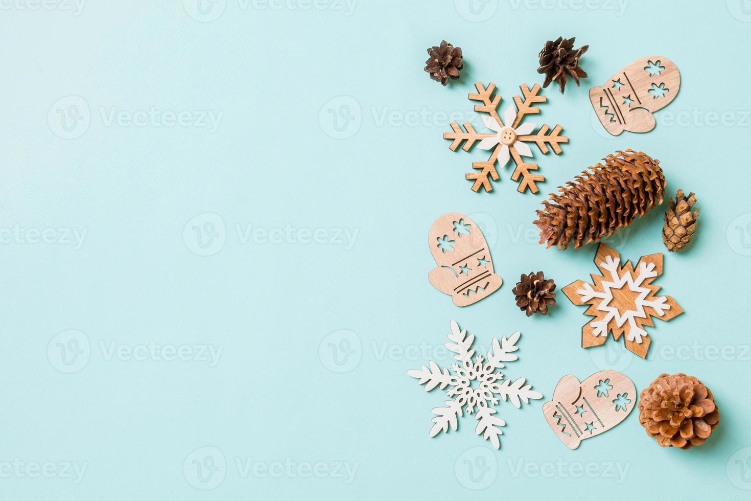 Top view of holiday toys and decorations on blue Christmas background. New Year time concept with copy space photo