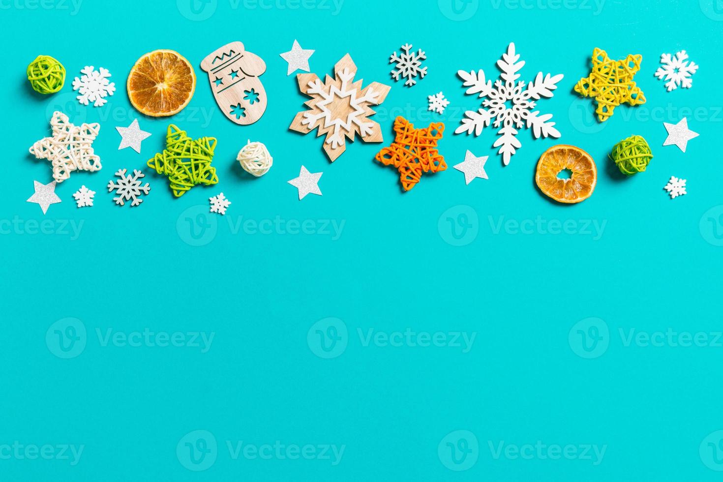 Top view of blue background with New Year toys and decorations. Christmas time concept with copy space photo