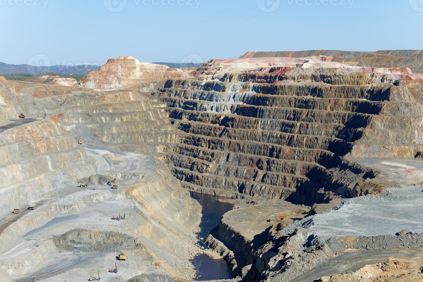 View of Mining activity in Minas de Riotinto in Spain. Apocalypse scenery. Extractivism. Mining village in Andalusia. Earth destruction. Disruption of nature. Mining industry. photo