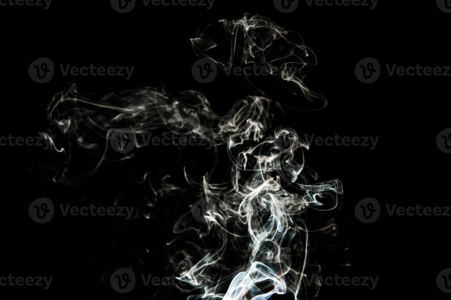 Smoke effect texture. Isolated background. Black and dark backdrop. Smokey fire and mistic effect. photo