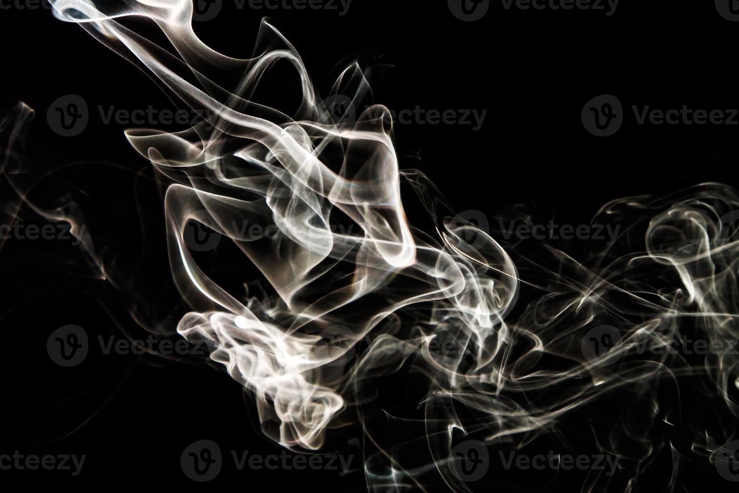 Smoke effect texture. Isolated background. Black and dark backdrop. Smokey fire and mistic effect. photo