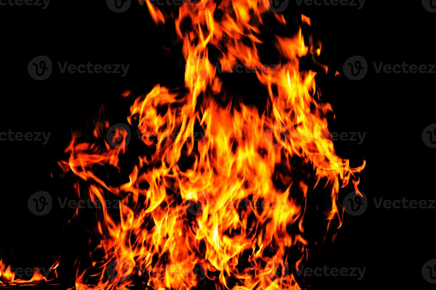 Fire flame texture. Burning material backdrop. Burn effect pattern. Blaze and torch wallpaper. Heat and haze backdrop. photo