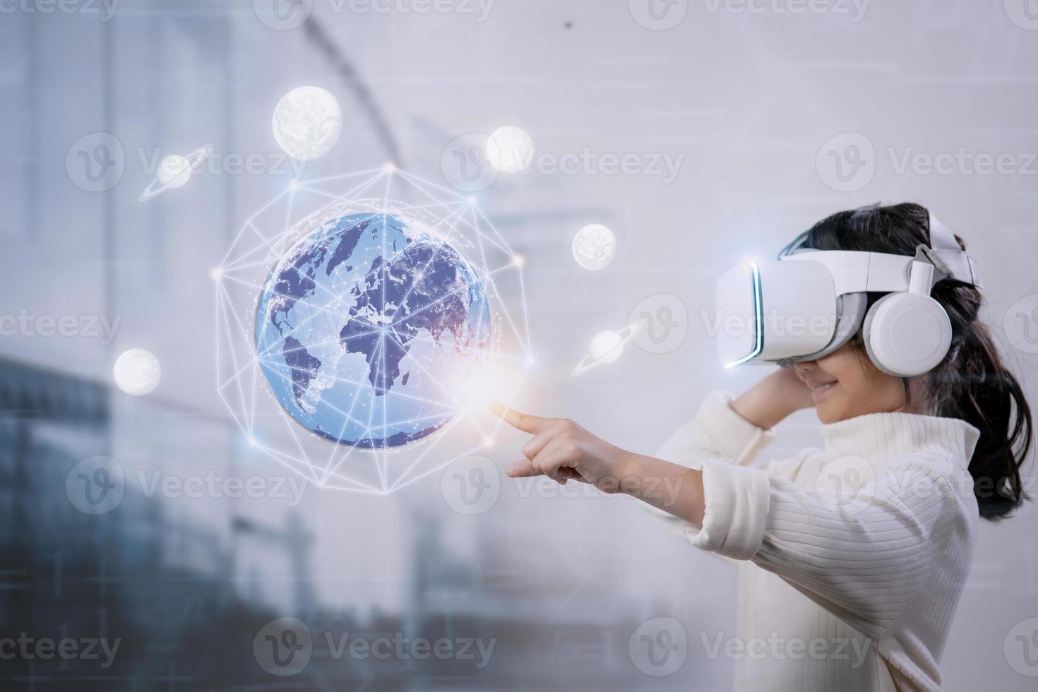 Metaverse Technology concepts. Little girl and experiences of metaverse virtual world photo