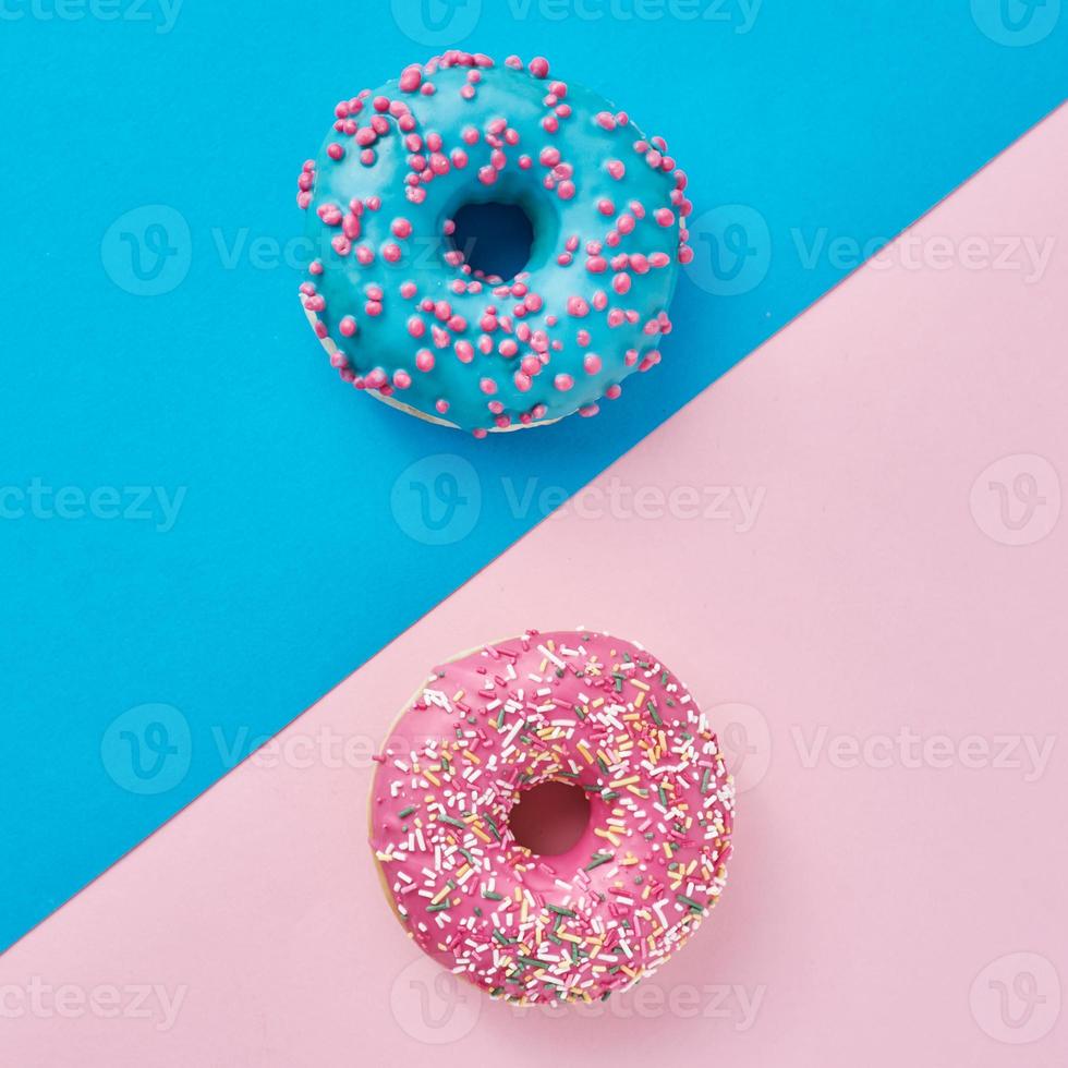 Two donuts on a pastel pink and blue background. 14264530 Stock Photo