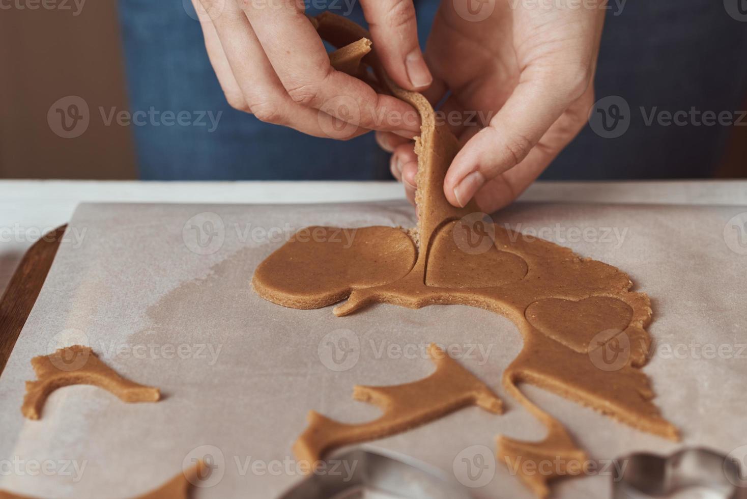 Making gingerbread cookies in the shape of a heart for Valentines Day. photo