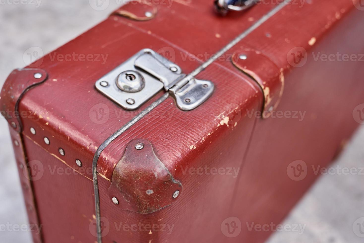 Part of vintage retro suitcase. Closeup view of lock on old suit case photo