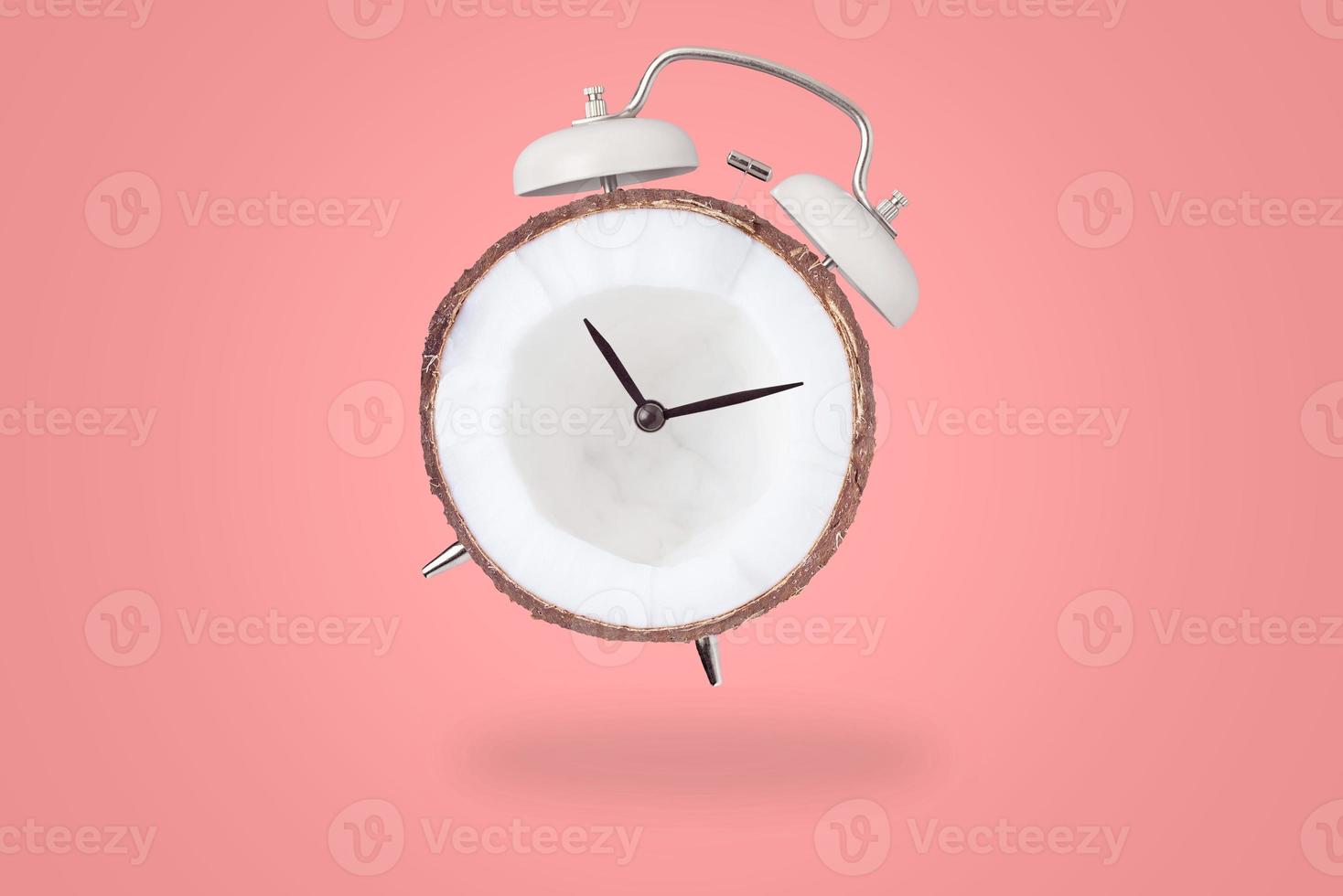 White retro alarm clock on the red background with copy space. Time concept photo