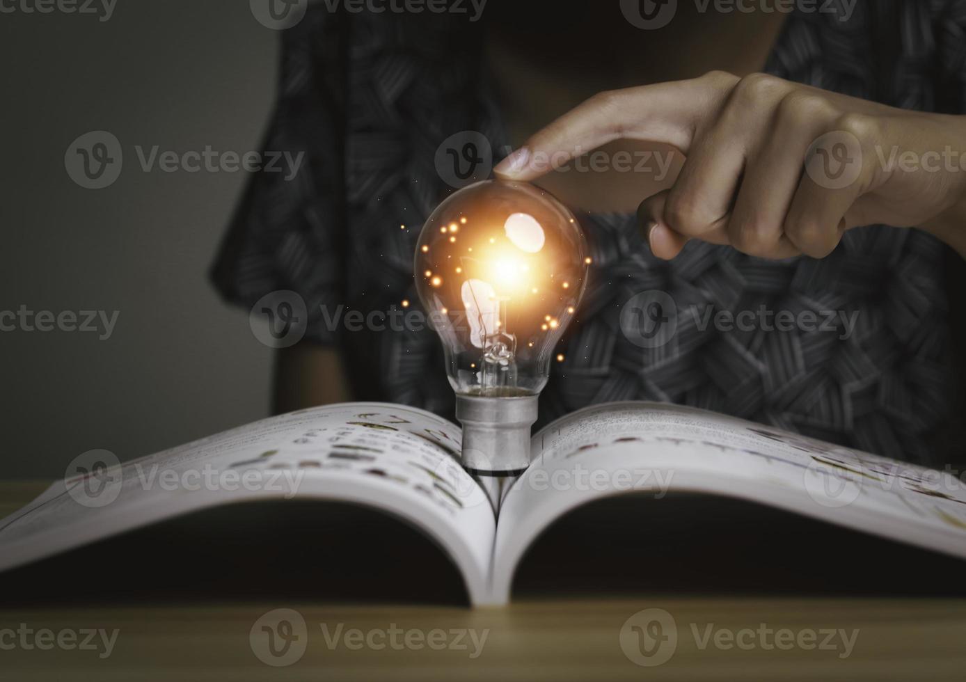 Businesswoman holding a light bulb, Creative new idea. Innovation, brainstorming, solution and inspiration concepts. imagination, creative thinking problem solving. photo