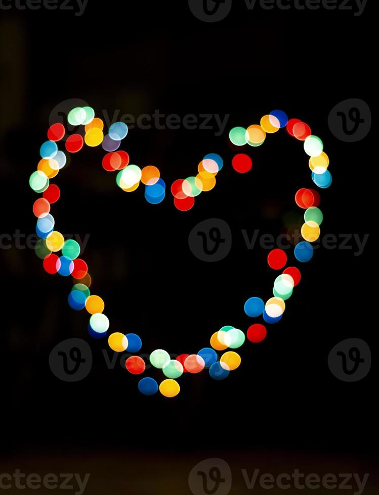 Bokeh with the shape of a heart with multi colors photo