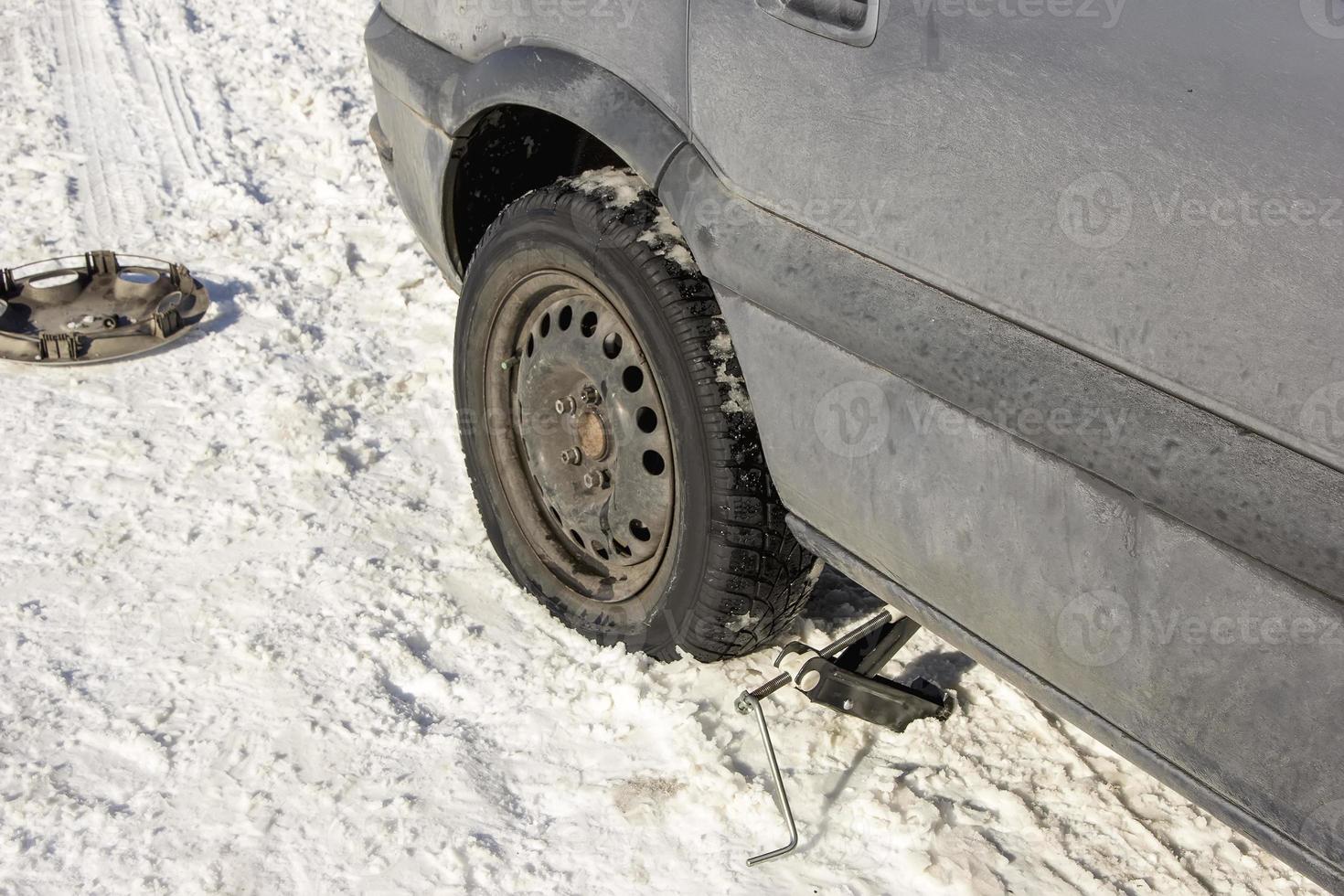 flat tire in the winter snow photo