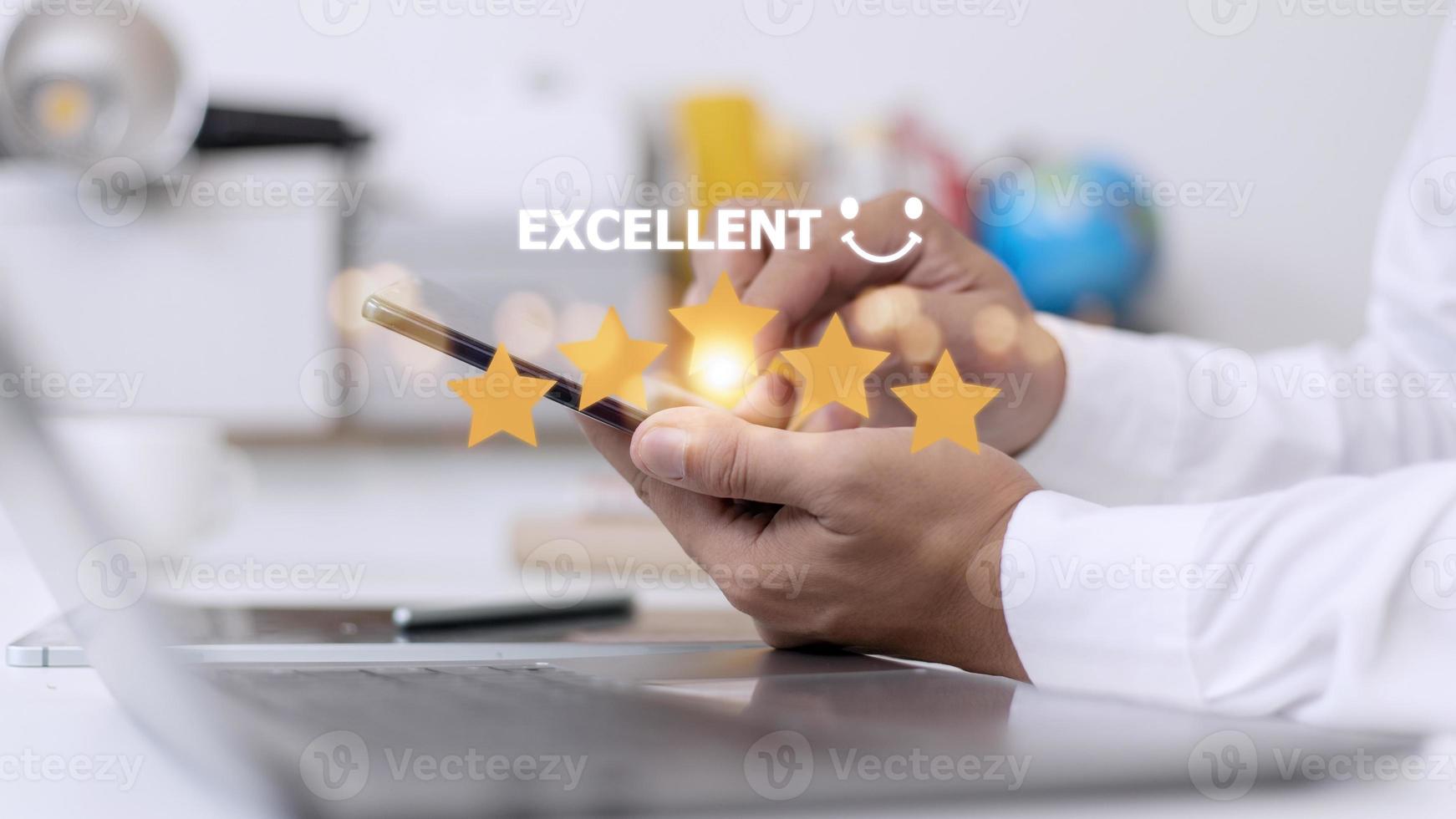 customer hand  with gold five star rating feedback icon and press level excellent rank for giving best score point to review the service, business concept photo