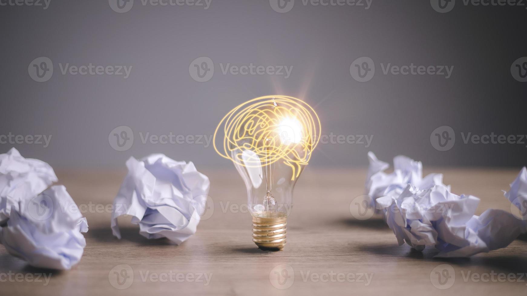 Education concept image. Creative idea and innovation. Crumpled paper as light bulb metaphor over photo