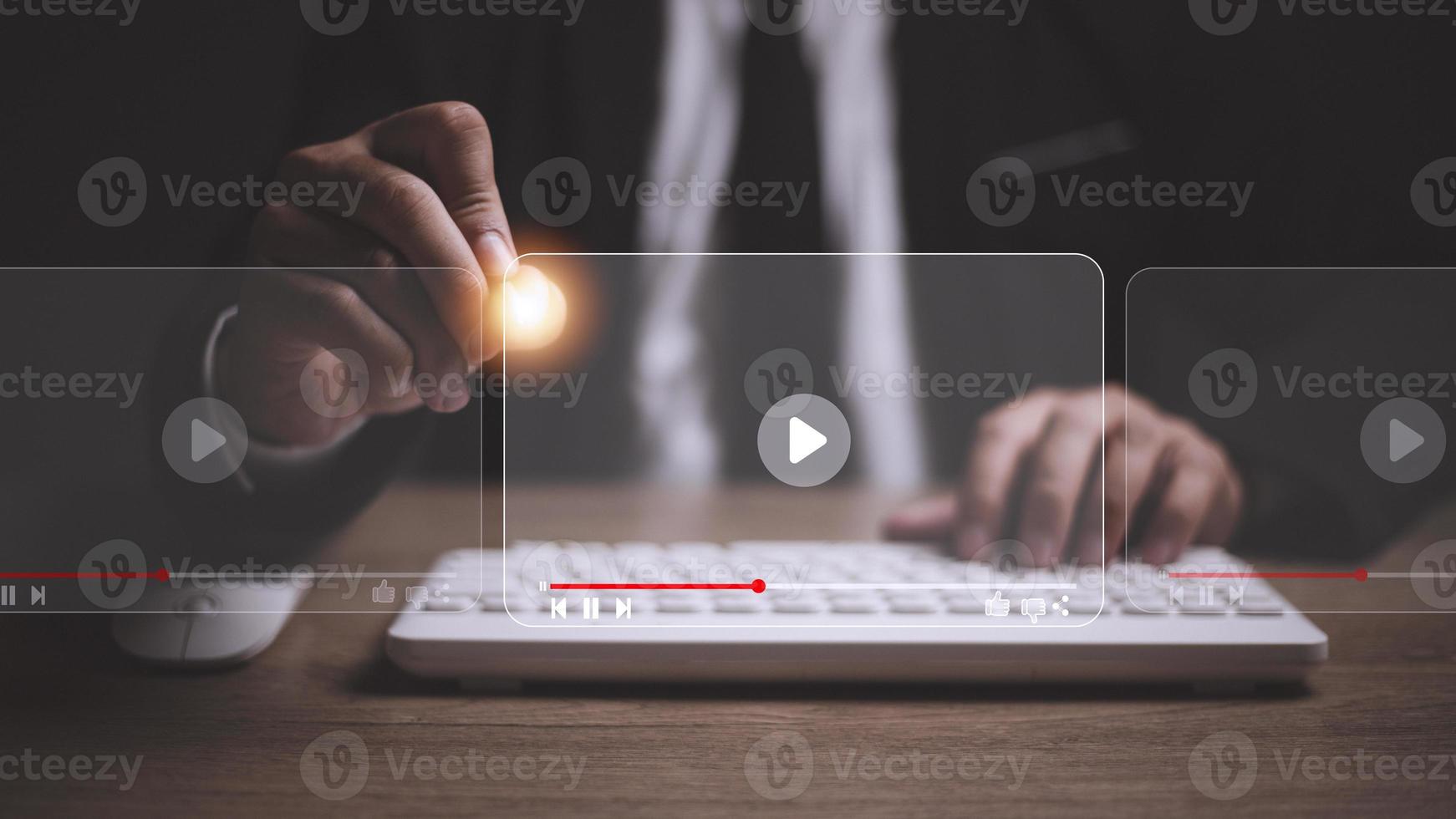 man using mouse and keyboard for streaming online, watching video on internet, live concert, show or tutorial photo