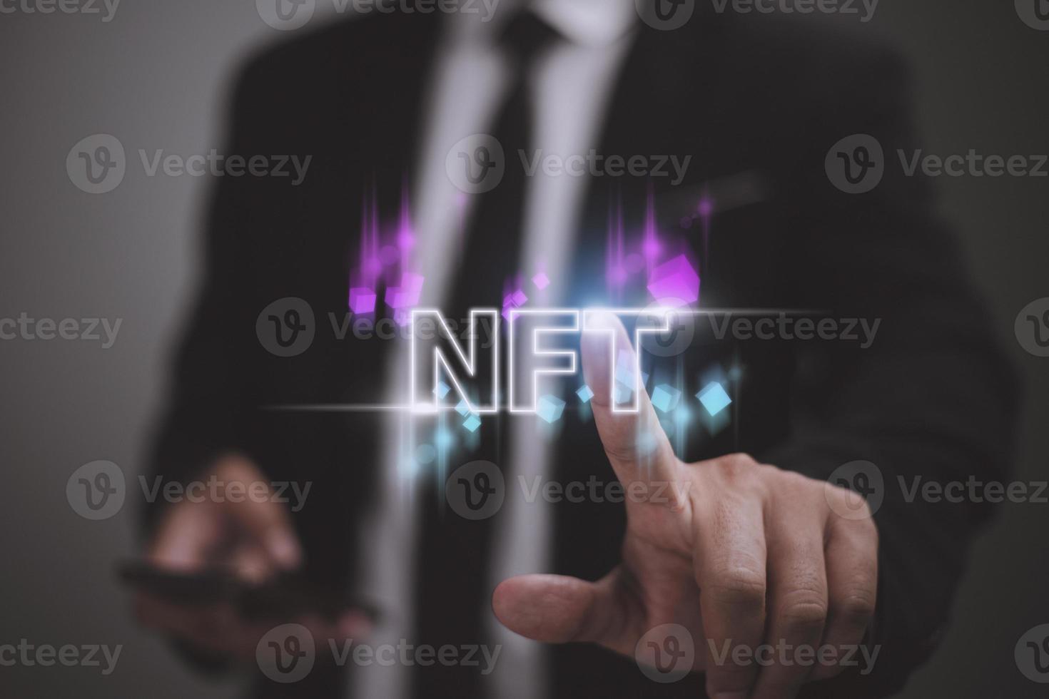 businessman finger touch virtual screen, NFT token digital crypto art blockchain technology concept photo