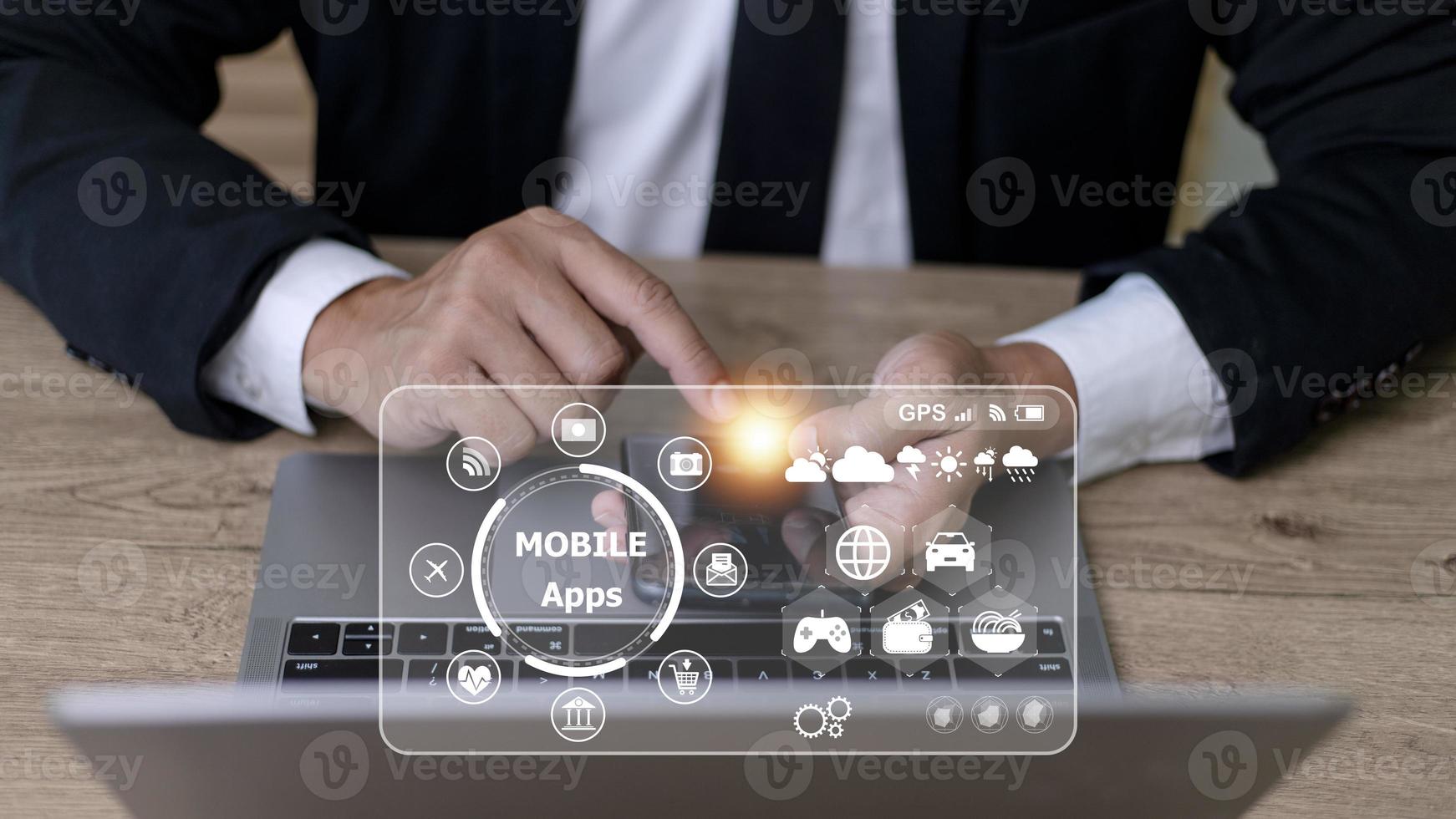 mobile apps concept.Business man hands holding touch screen smartphone outside in the park,color filter,all element graphic are made up by me photo