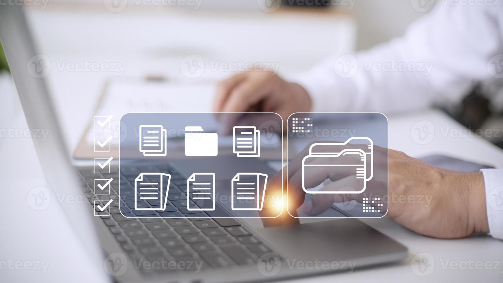 Document Management System DMS being setup by IT consultant working on laptop computer in office. Software for archiving, searching and managing corporate files and information photo