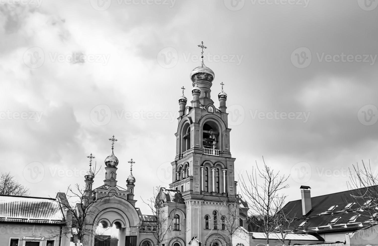 Christian church cross in high steeple tower for prayer photo