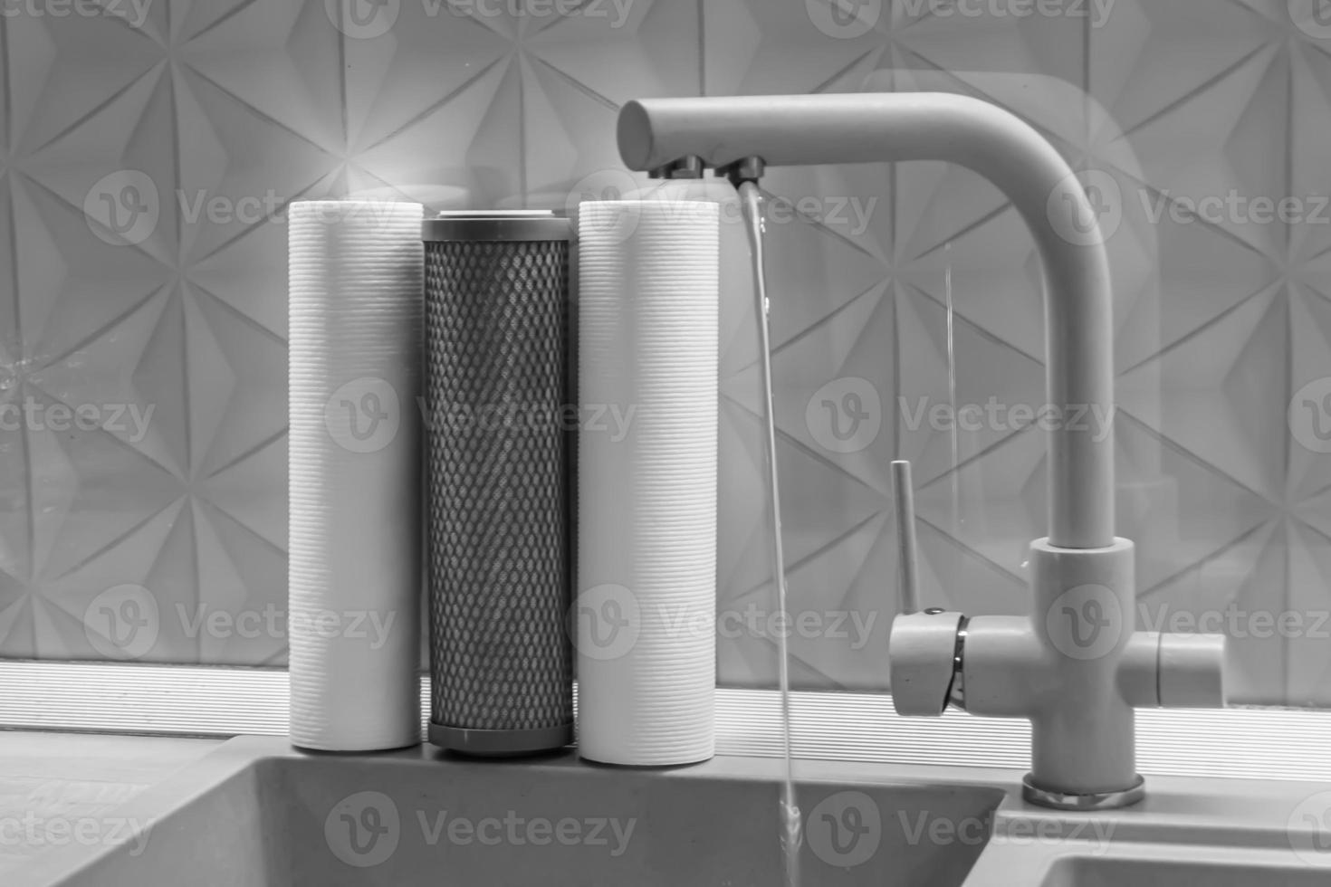 water filter cartridge for home on background kitchen photo