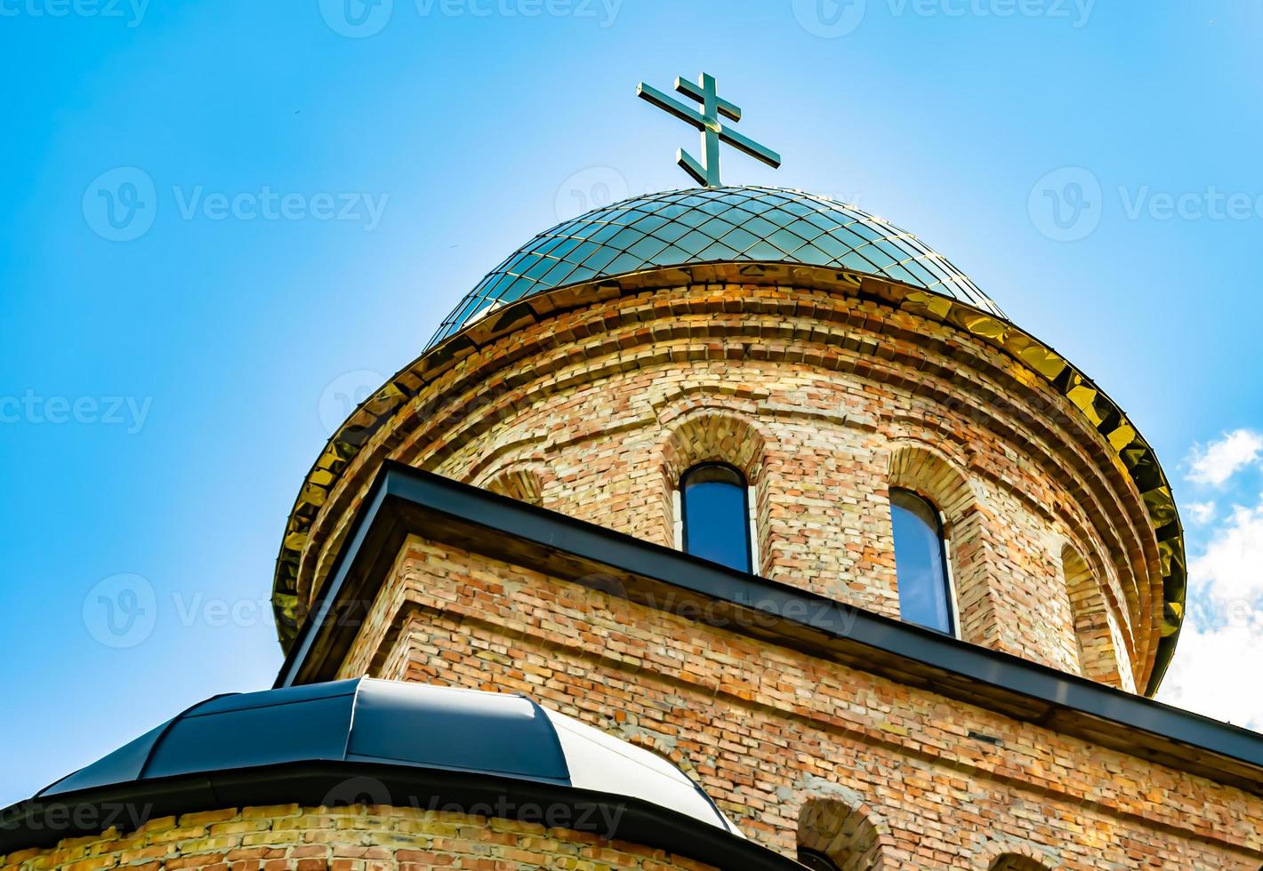 Christian church cross in high steeple tower for prayer photo