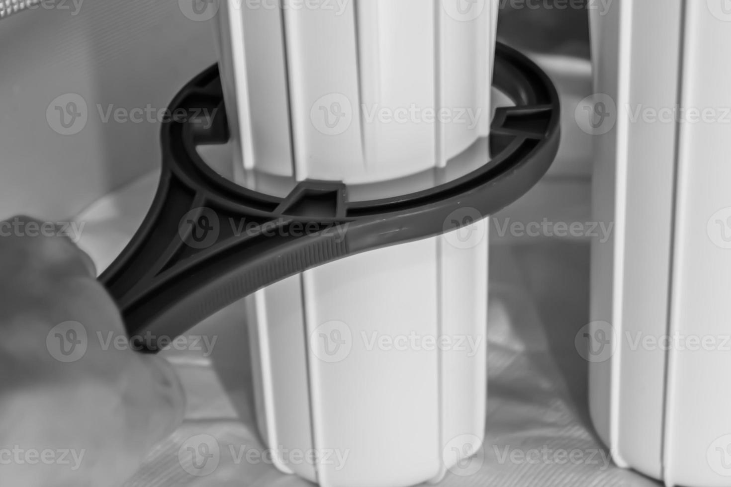 water filter cartridge for home on background kitchen photo